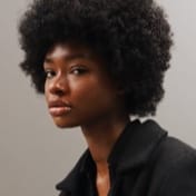 side profile of jessica 'african-american' looking at the camera
